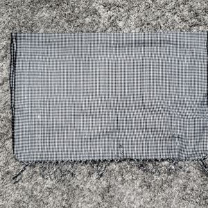 Gently used black and white checkered scarf